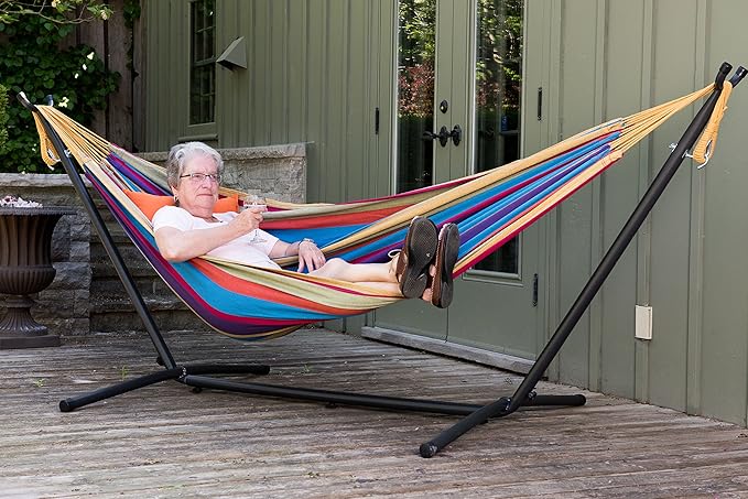Vivere Double Cotton Hammock with Space Saving Steel Stand, Upgraded Polyester End Strings 450 lb Capacity - Premium Carry Bag Included - (Tropical)